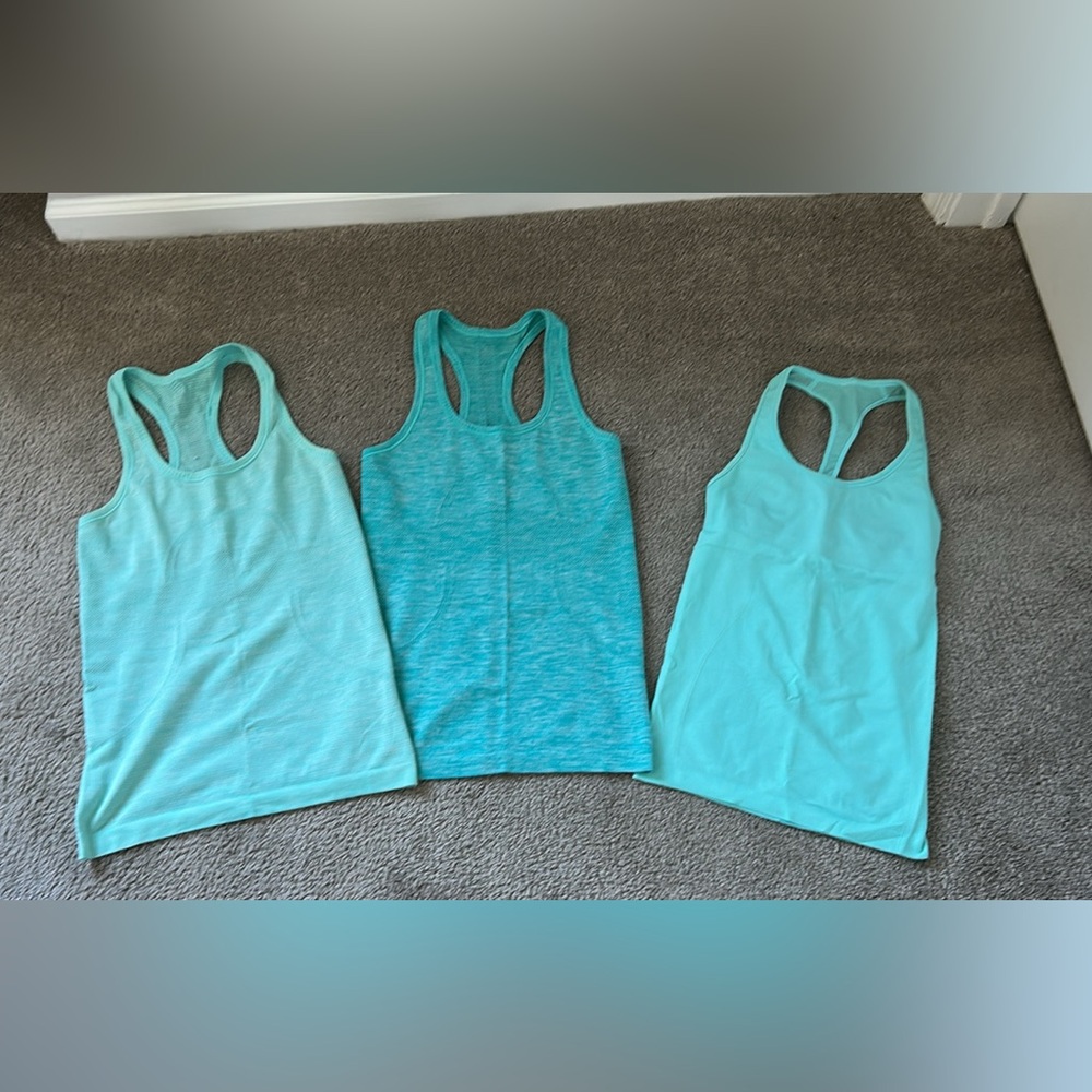 Three Lululemon Tank Tops, Size 4. Excellent Condition.